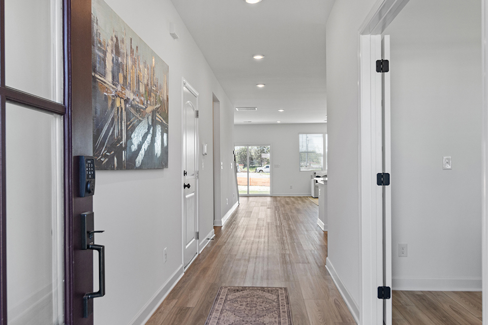 A hallway with white walls.