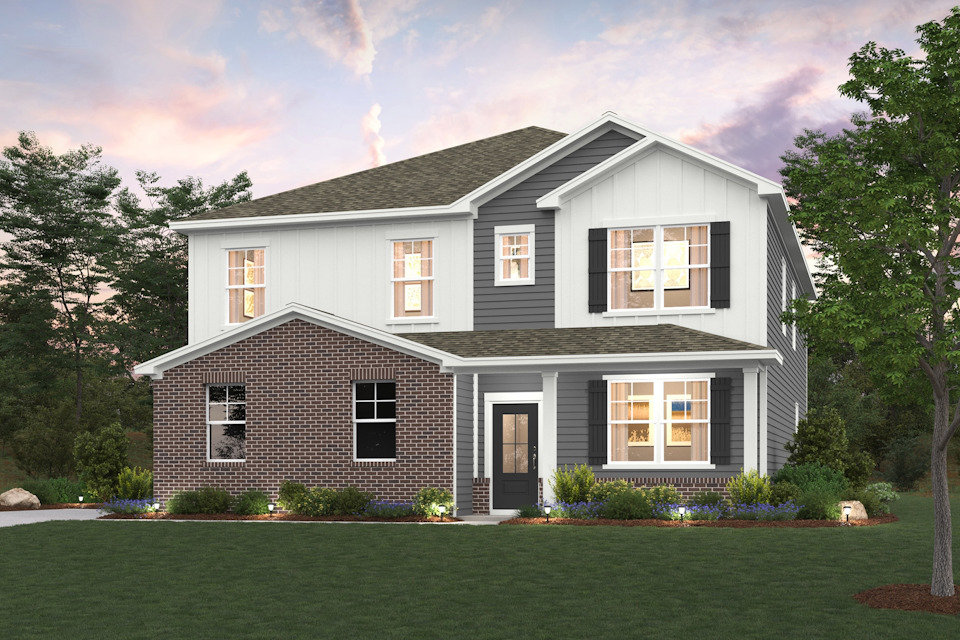 A house with a lawn in front of it.