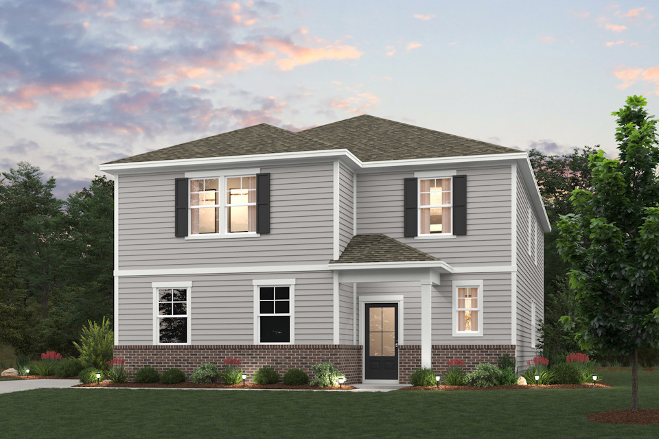 A house with a lawn in front of it.