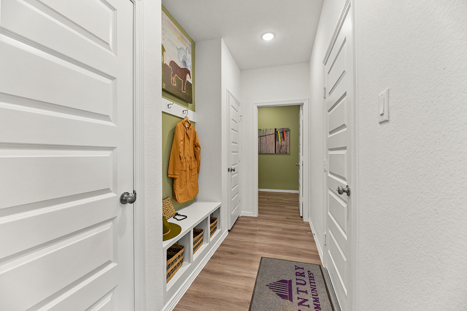 A hallway with white walls.