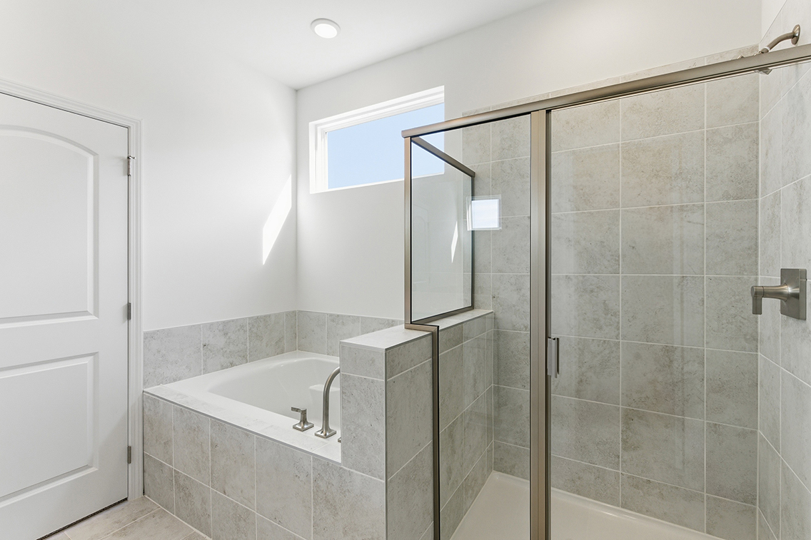 A bathroom with a glass shower.