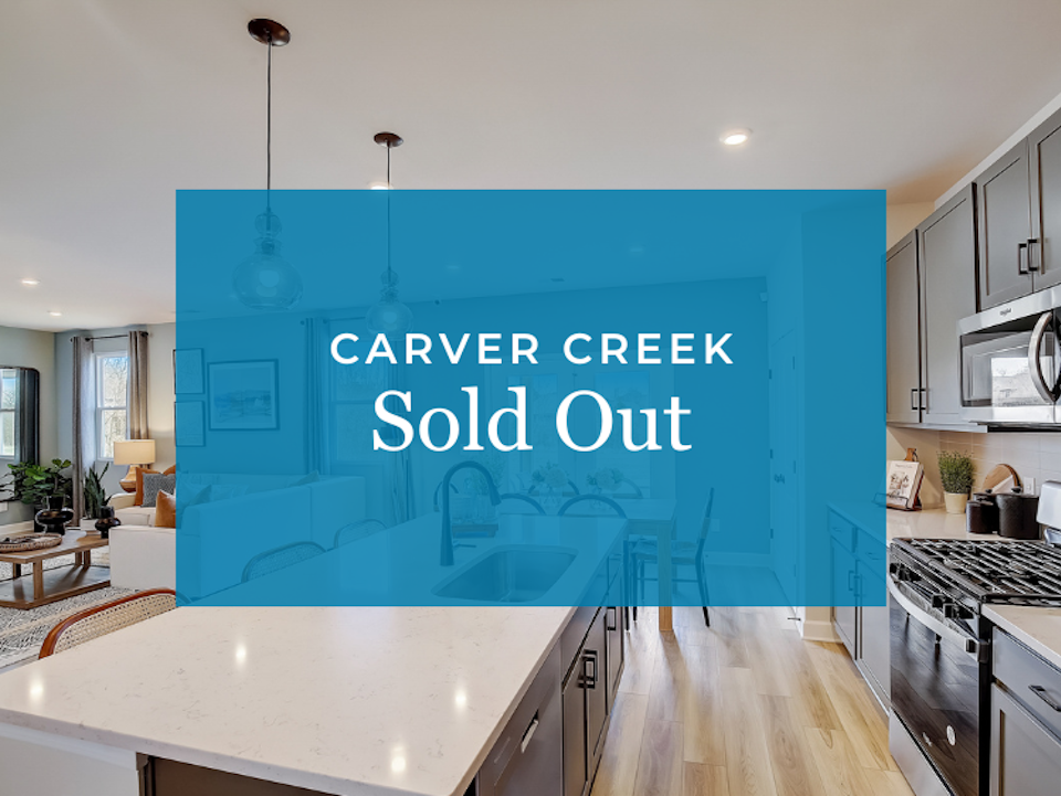 A kitchen with a blue wall.