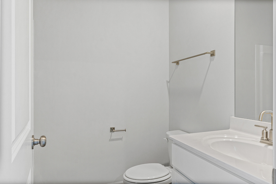 A bathroom with a toilet and sink.