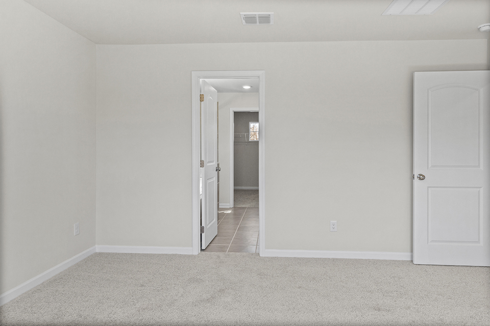 A hallway with white doors.