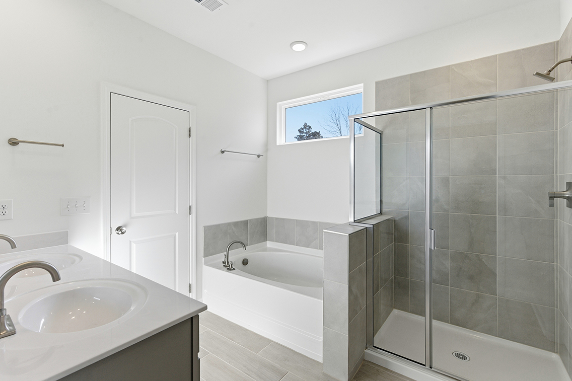 A bathroom with a glass shower.