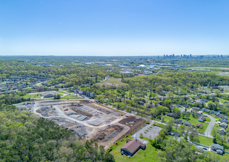 A landscape with a river and trees.