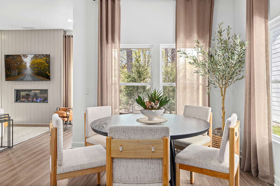 A room with a table and chairs.