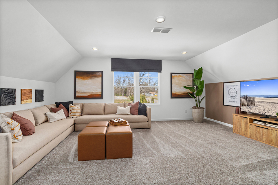 A living room with a couch and a table.