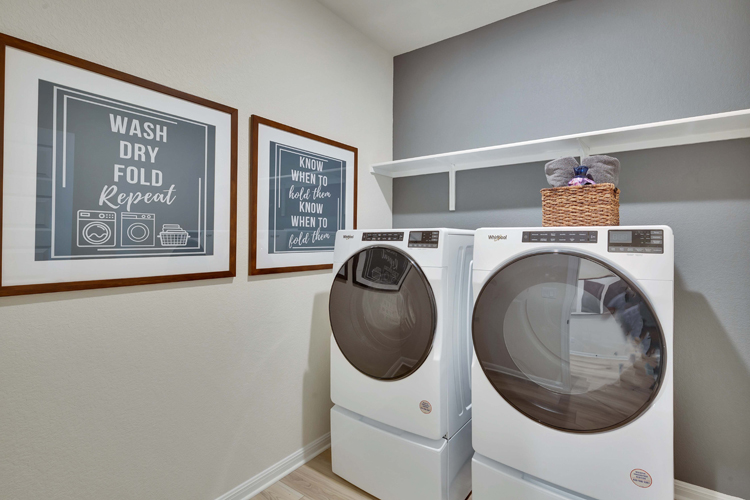 A washing machine in a room.