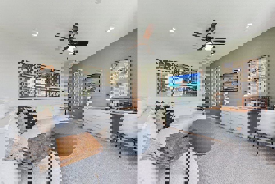 A living room with a couch and a tv.