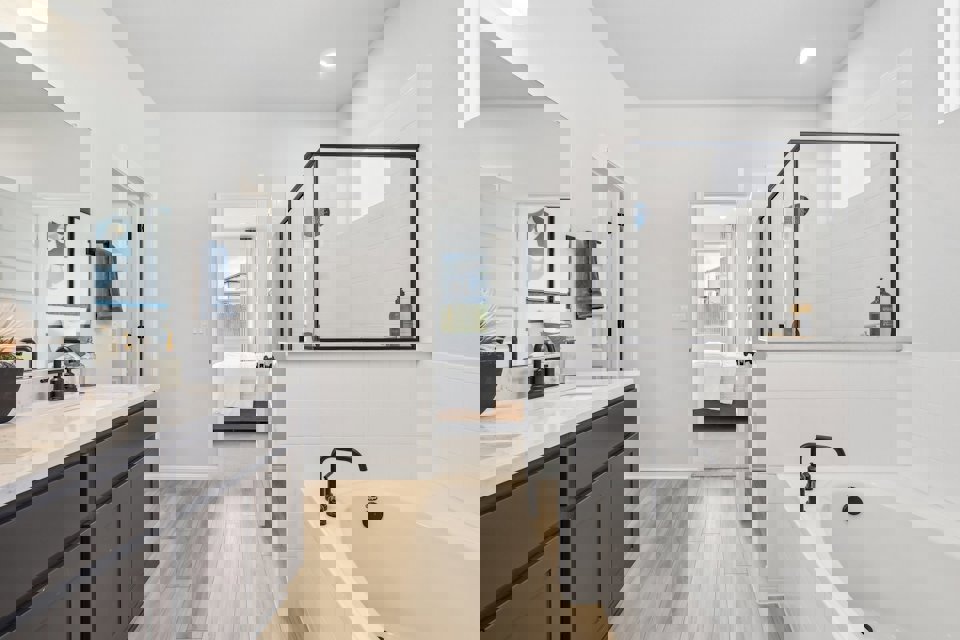 A bathroom with a tub and sink.