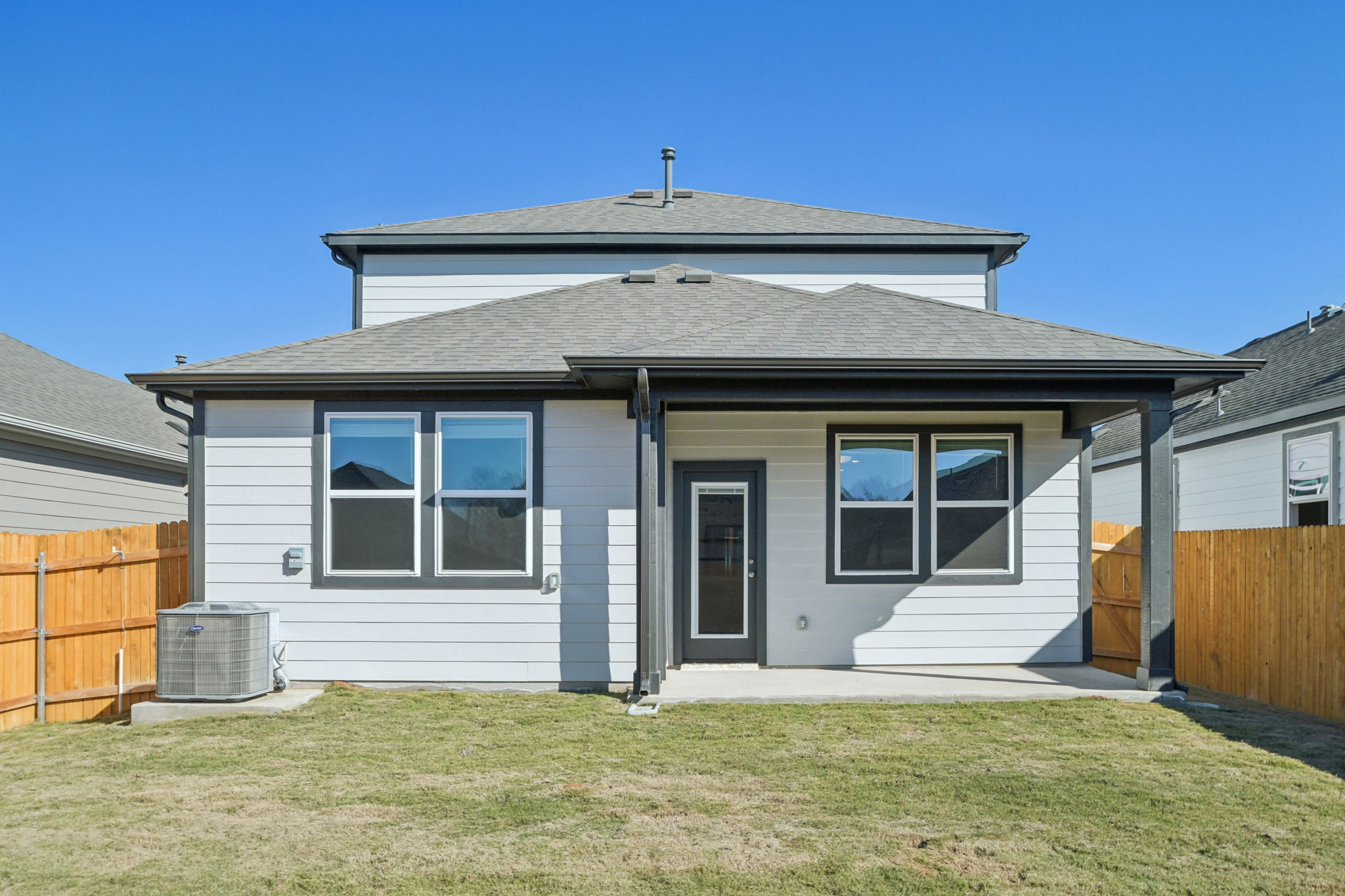 A small house with a fence.