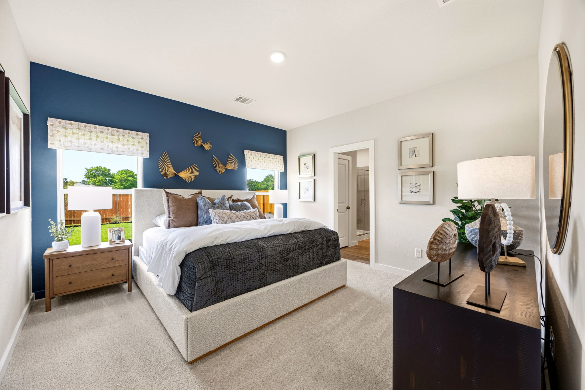 A bedroom with a bed and a desk.