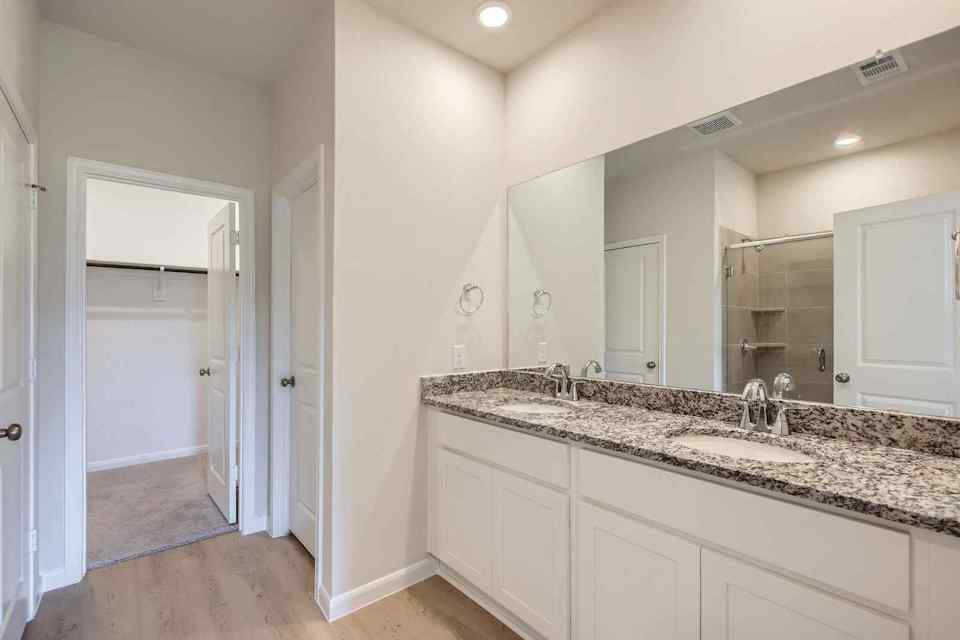 A bathroom with a marble countertop.