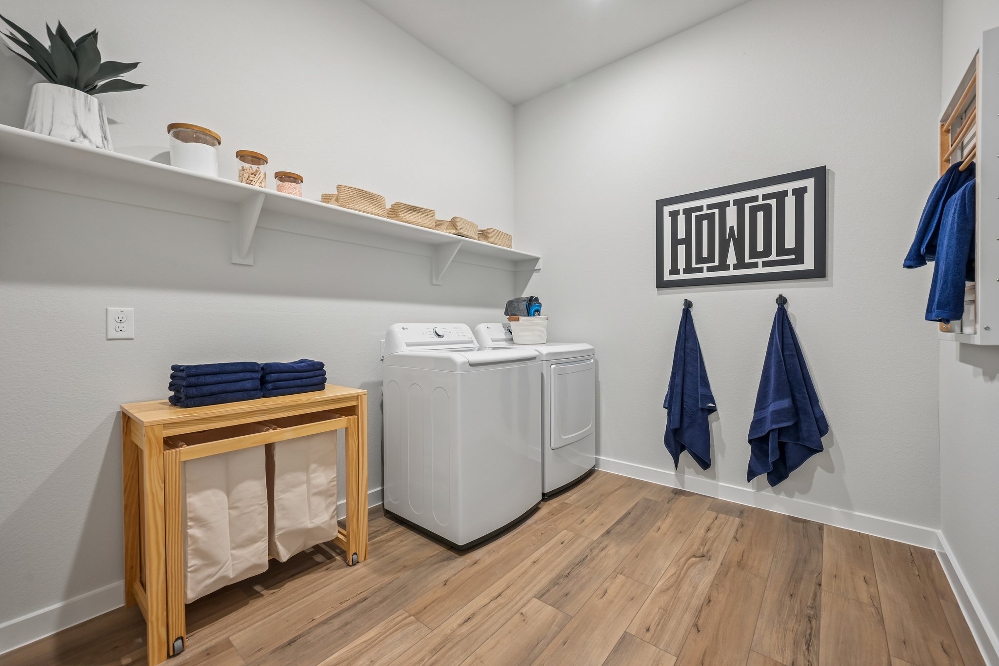 A room with a washer and dryer.