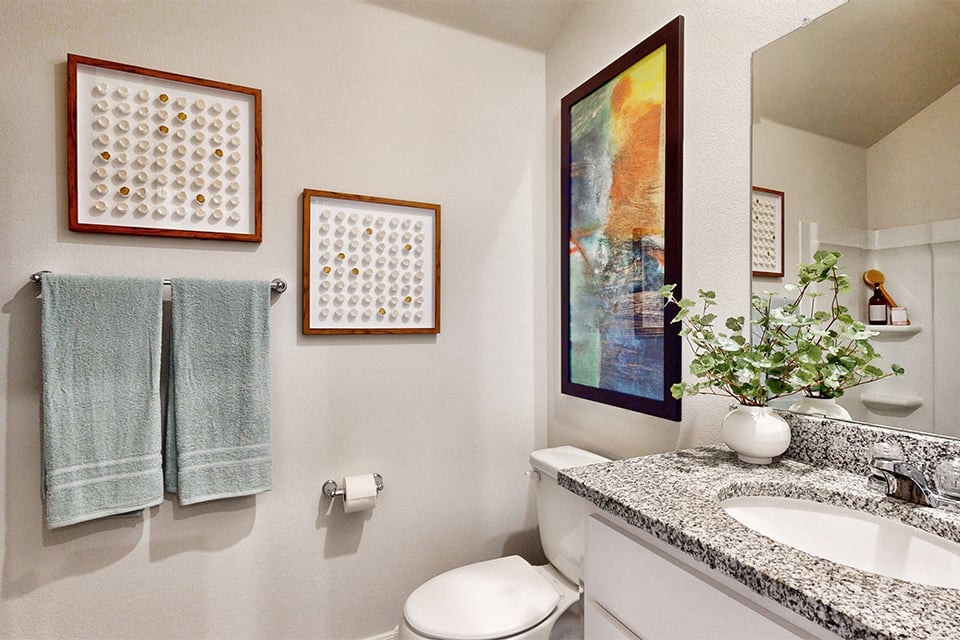 A bathroom with a sink and a toilet.