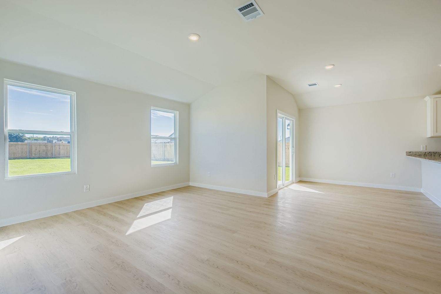 A room with a wood floor and a wood floor.
