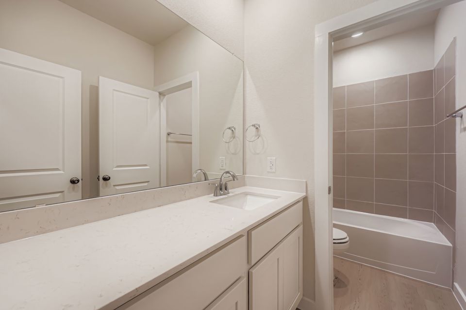 A bathroom with a sink and a bathtub.