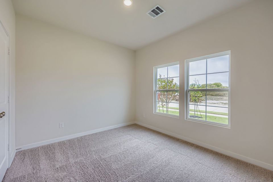 A room with a window and a door.