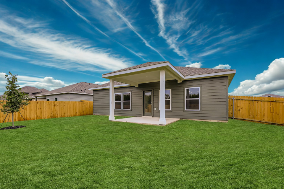 A house with a grass yard.