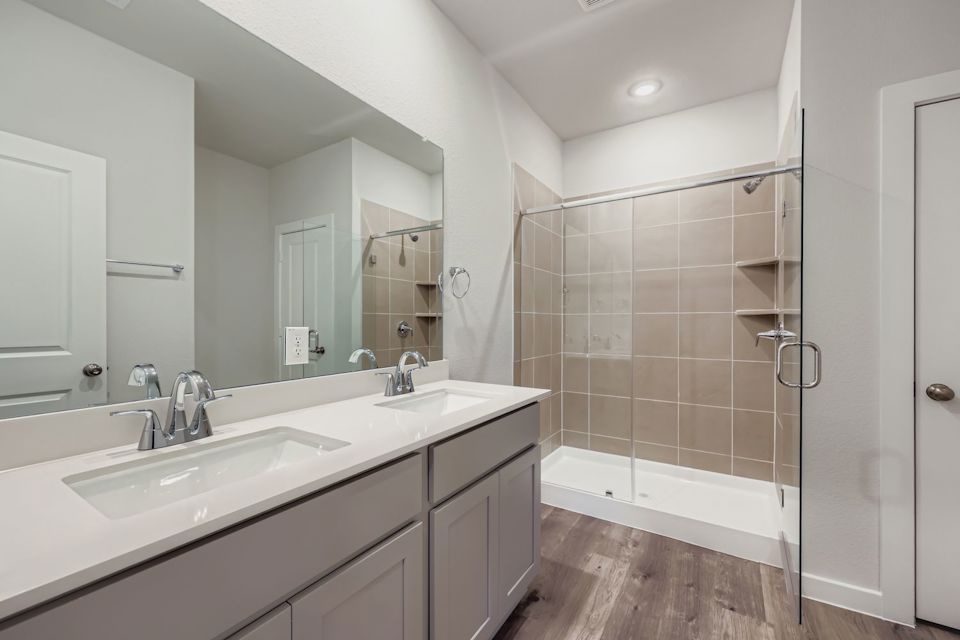 A bathroom with a glass shower.