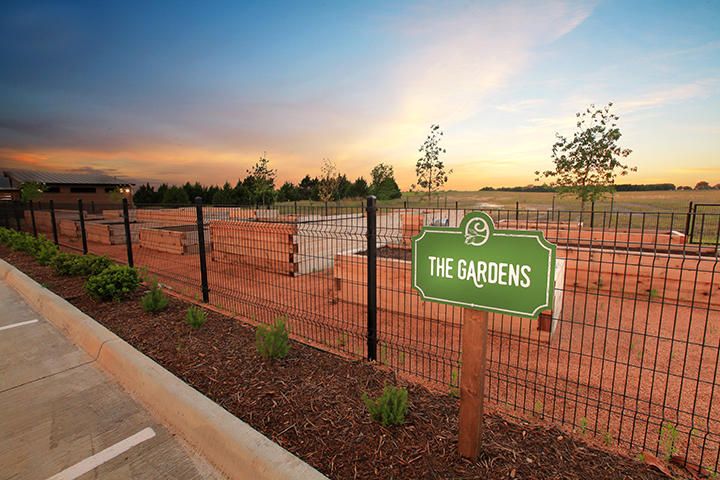 A sign on a fence.