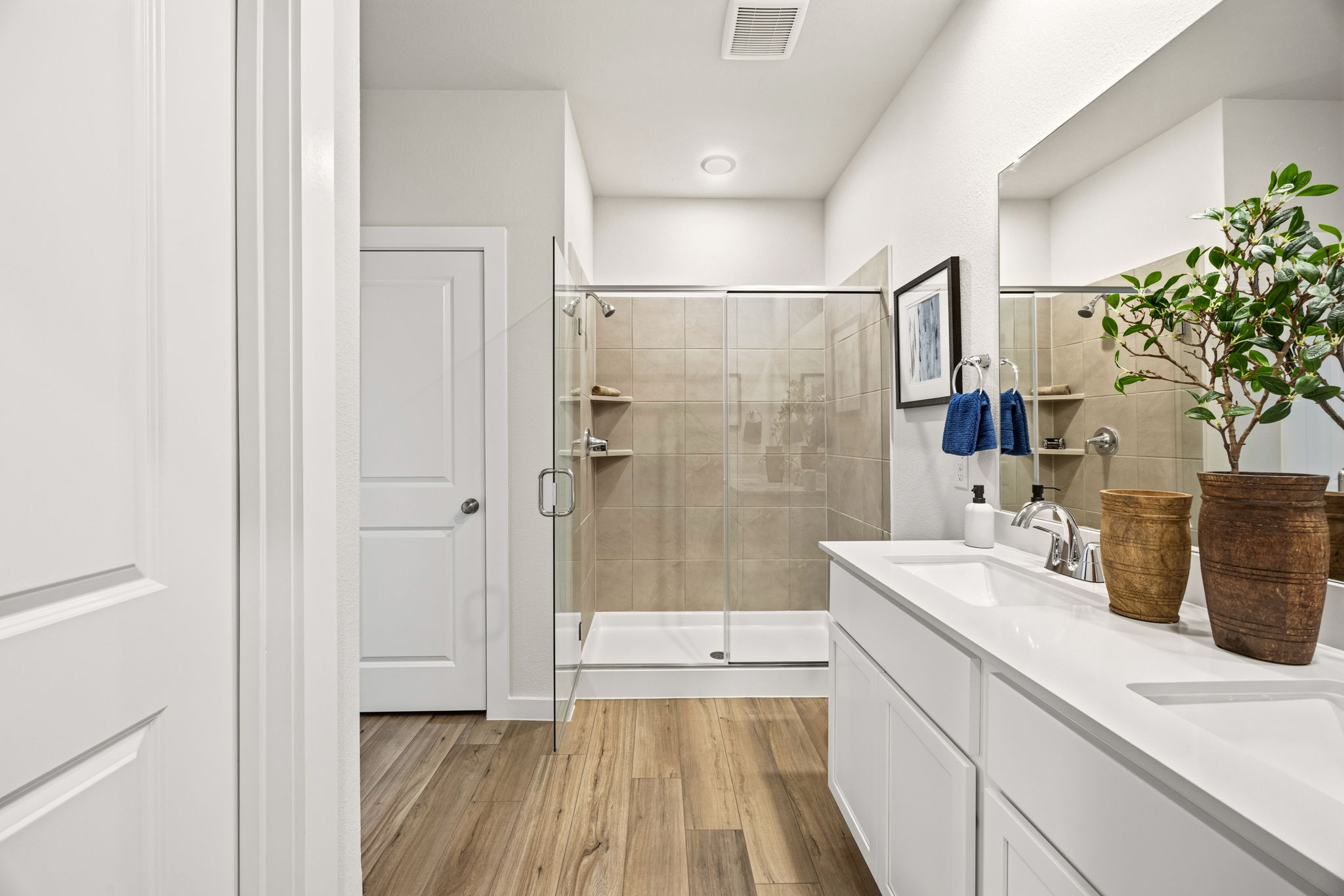 A bathroom with a glass shower.