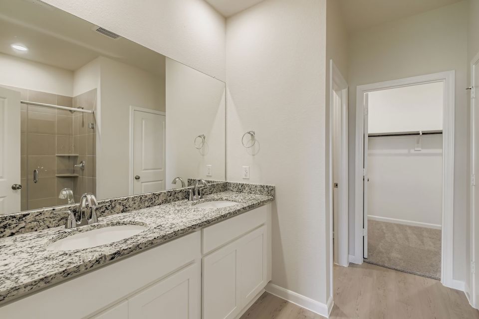 A bathroom with a marble countertop.