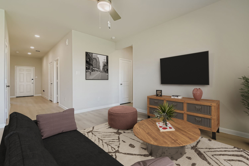 A living room with a couch and a coffee table.