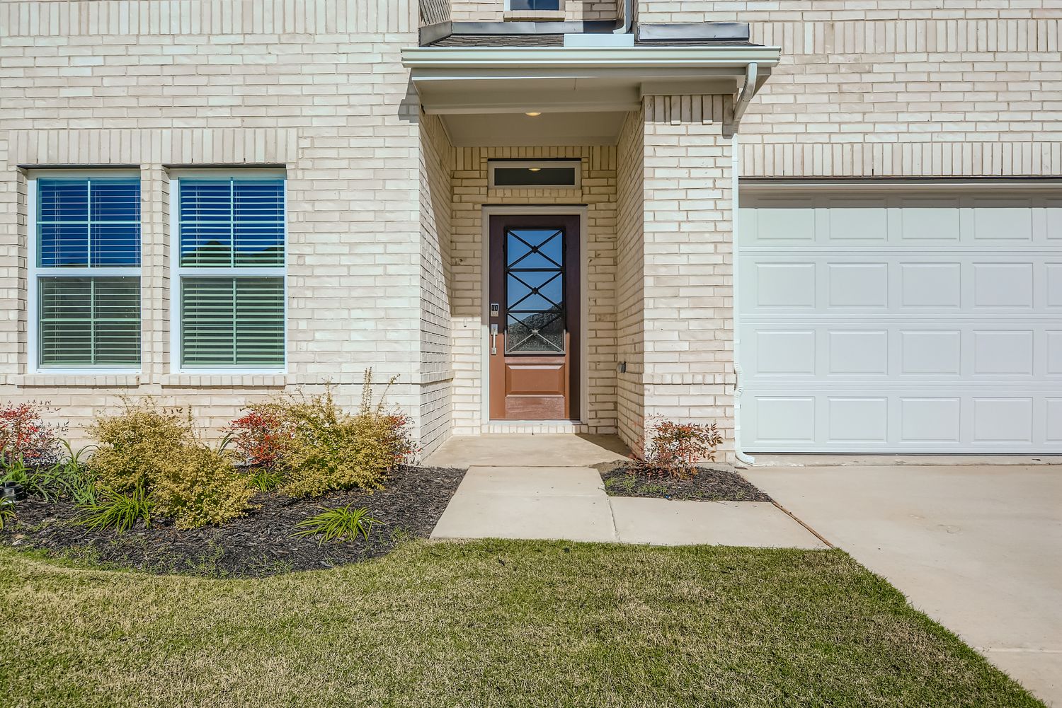 A house with a door and a driveway.