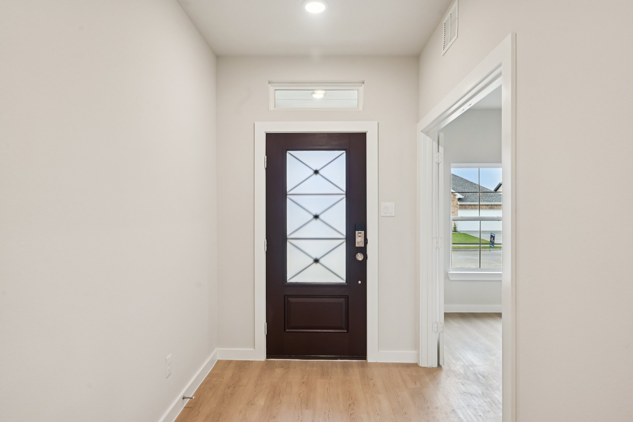 A room with a door and a window.