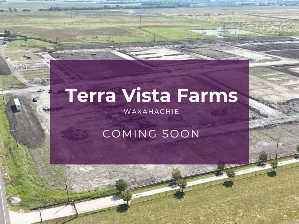 A large field with a sign.