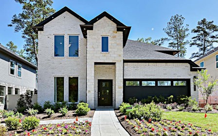 A house with a large front yard.