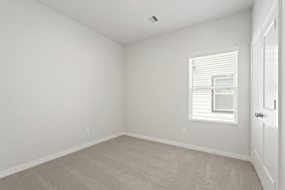 A room with a door and a window.