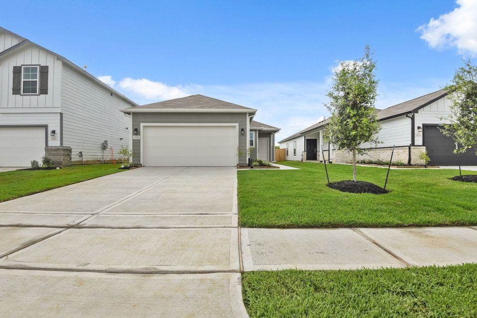 A driveway leading to a house.