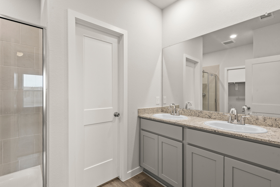 A bathroom with a marble countertop.