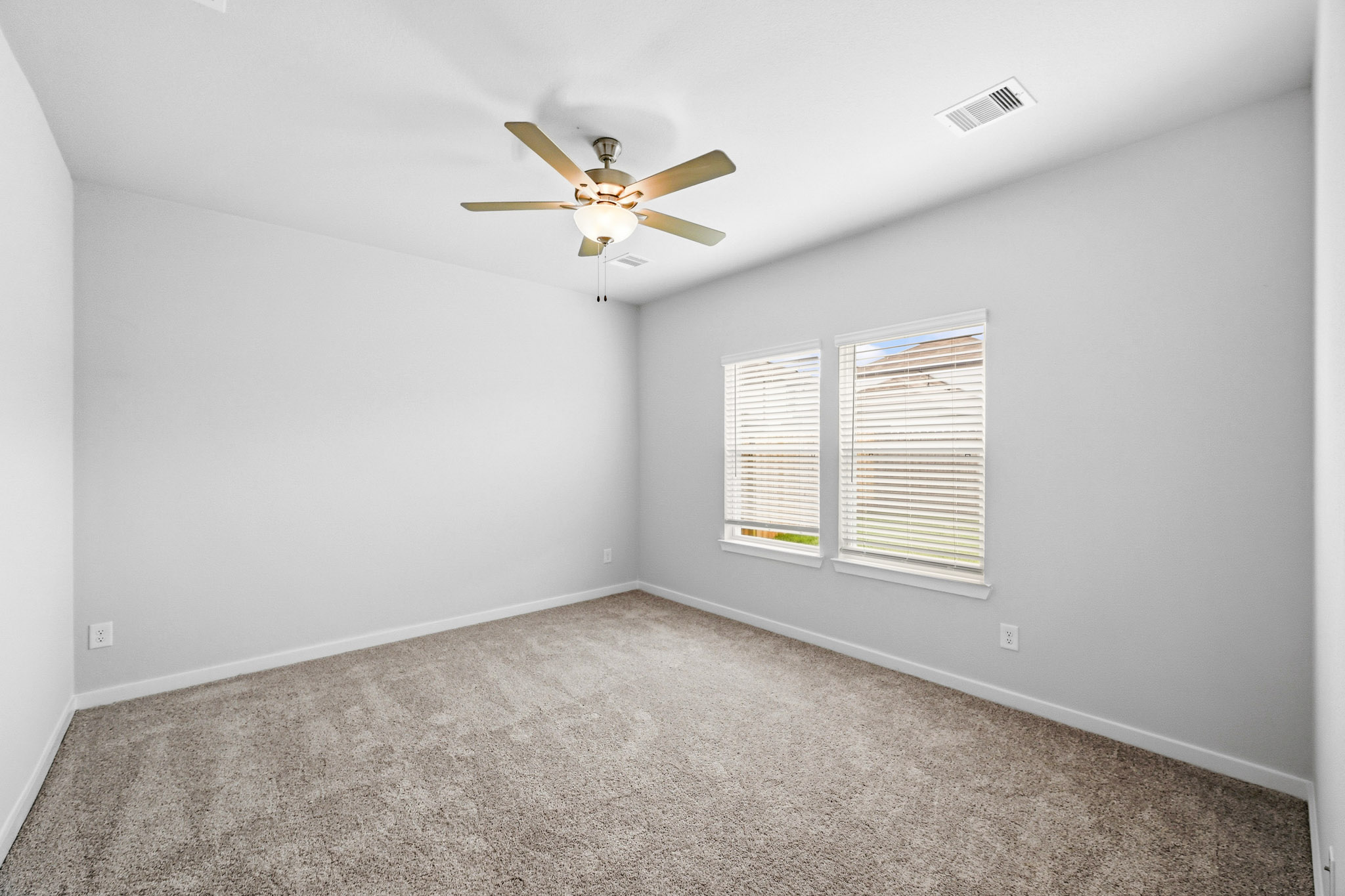 A ceiling fan in a room.