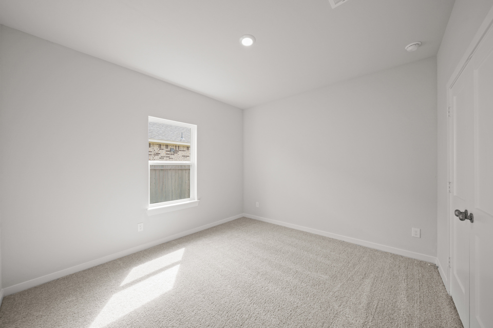 A room with a door and a window.