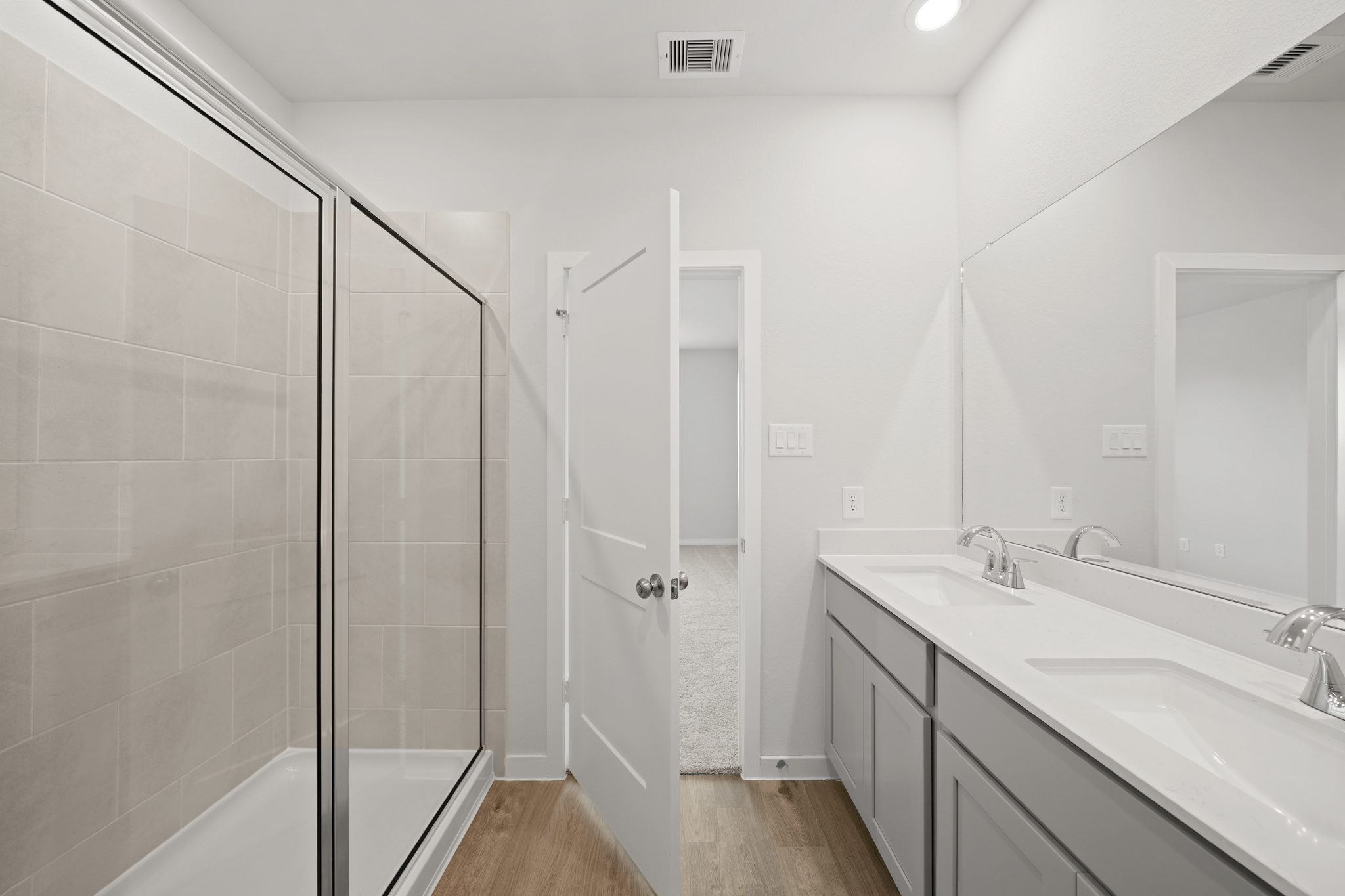 A bathroom with a glass shower.