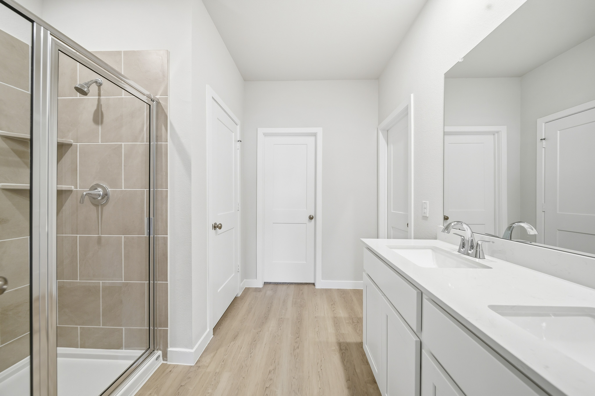 A bathroom with a glass shower.