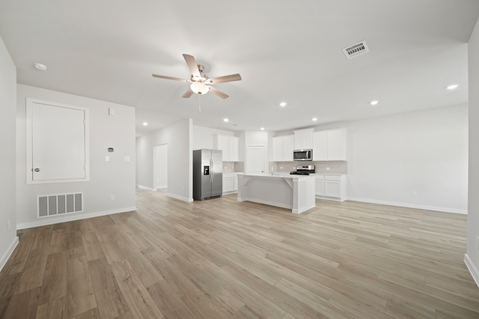A large kitchen with white cabinets.