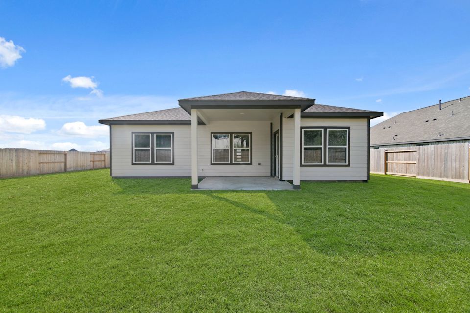 A house with a grass yard.
