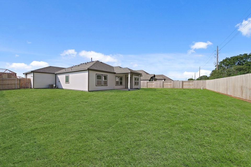 A house with a green lawn.