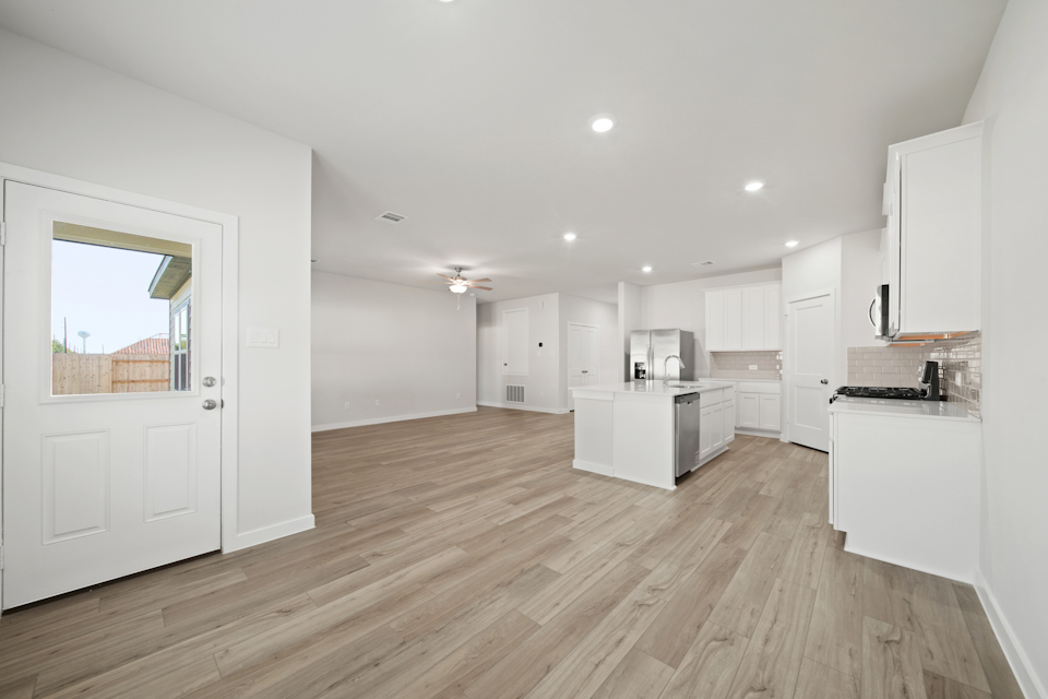 A large kitchen with white cabinets.