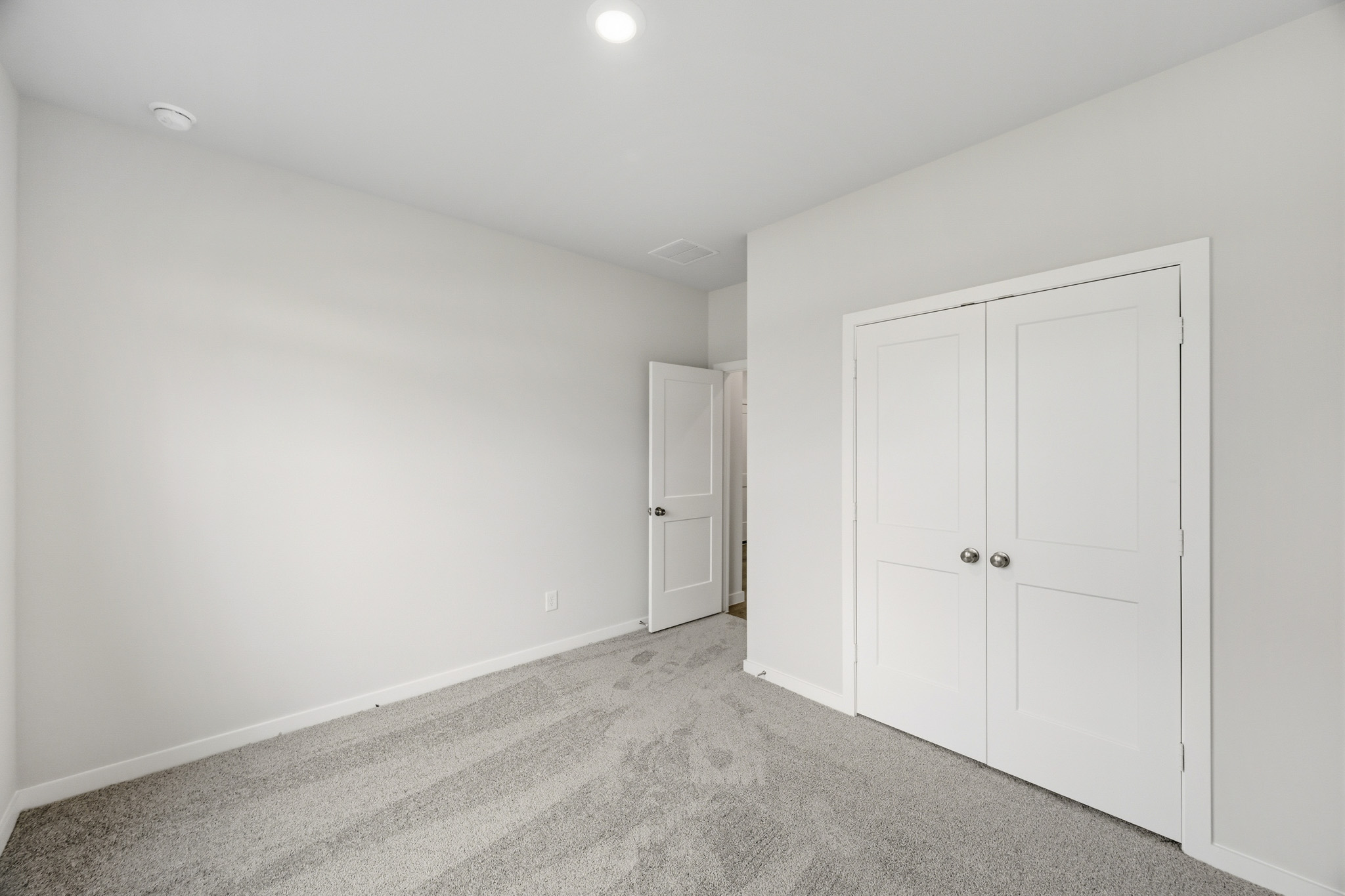 A room with white doors.