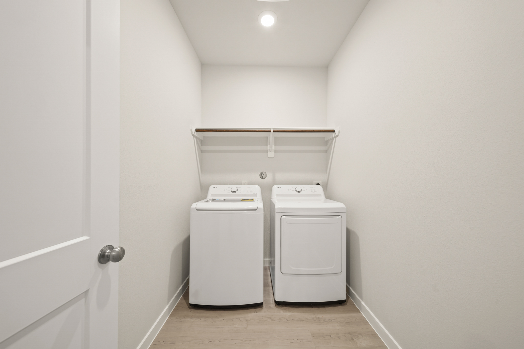 A white room with a white wall and a white cabinet.