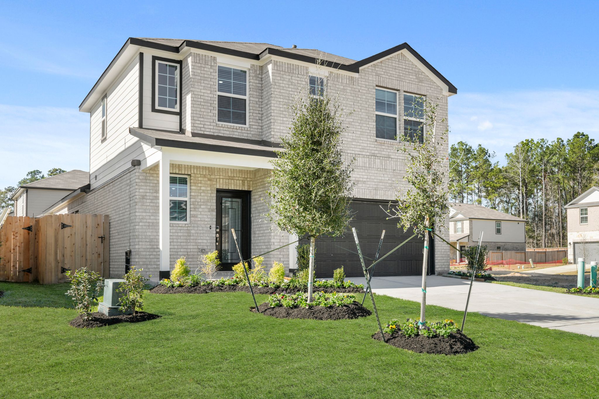 A house with a yard and trees.