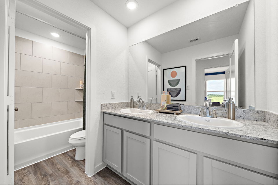 A bathroom with a marble countertop.