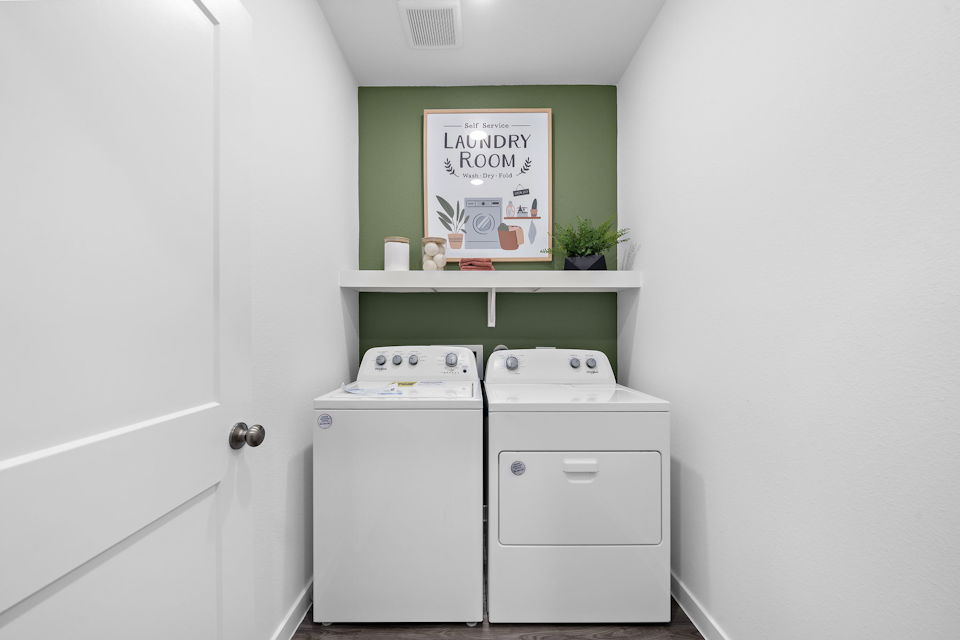 A white cabinet with a sign on it.