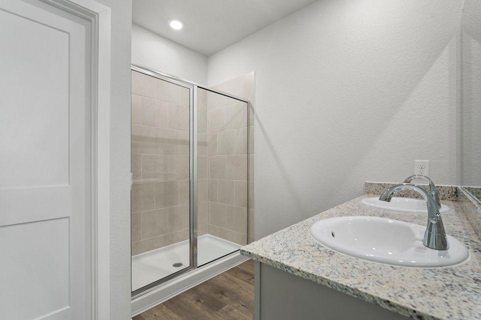 A bathroom with a glass shower.
